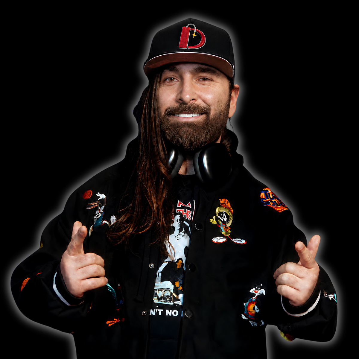 Dynamitri in a Space Jam letterman jacket and cap with headphones - the music industry side of the work